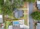 Aerial view of home with mature landscaping, a private pool and a fenced yard at 814 Jefferson Ave, Lakeland, FL 33801