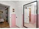 Stylish pink bathroom featuring a walk in shower and tile flooring at 814 Jefferson Ave, Lakeland, FL 33801