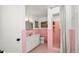 Pink tiled bathroom featuring shower and vanity at 814 Jefferson Ave, Lakeland, FL 33801