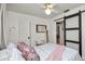 Bedroom featuring stylish barn door and light hardwood floors at 814 Jefferson Ave, Lakeland, FL 33801