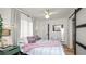 Cozy bedroom with a stylish barn door and neutral decor at 814 Jefferson Ave, Lakeland, FL 33801