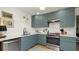 Well-lit kitchen with stainless steel appliances, light countertops, and ample storage space at 814 Jefferson Ave, Lakeland, FL 33801