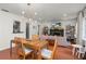 Bright living room with open floorplan, red tile floors, and modern chandelier at 814 Jefferson Ave, Lakeland, FL 33801