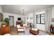 Stylish living room with hardwood floors, designer furniture, and a large window at 814 Jefferson Ave, Lakeland, FL 33801