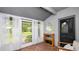 Relaxing porch with tile floors, sheer curtains and a view of the outdoors at 814 Jefferson Ave, Lakeland, FL 33801