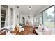 Inviting sun room with decor, neutral colors, mosaic tile floors, brick walls and plenty of natural light at 814 Jefferson Ave, Lakeland, FL 33801