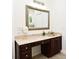 Bathroom with granite vanity and large framed mirror, offering an elegant design at 830 Miami Springs Dr, Longwood, FL 32779