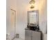 Bathroom features modern vanity, designer mirror, and lighting fixture at 830 Miami Springs Dr, Longwood, FL 32779