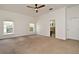 Spacious bedroom with natural light, neutral carpet, and a ceiling fan at 830 Miami Springs Dr, Longwood, FL 32779
