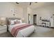 Bright bedroom features neutral walls, decor, and furnishings creating a clean, comfortable retreat at 830 Miami Springs Dr, Longwood, FL 32779