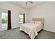 Bright bedroom has neutral walls, access to the outdoors, and a ceiling fan for added comfort at 830 Miami Springs Dr, Longwood, FL 32779