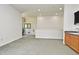 Spacious bonus room with plush carpeting, a wet bar, and ample space for entertaining or relaxing at 830 Miami Springs Dr, Longwood, FL 32779
