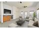 Inviting bonus room with comfortable seating, a wet bar, and natural light, ideal for relaxing and entertaining at 830 Miami Springs Dr, Longwood, FL 32779