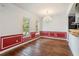 Elegant dining room boasts a stylish chandelier, hardwood floors, and well-lit windows at 830 Miami Springs Dr, Longwood, FL 32779