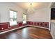 Elegant dining room with hardwood floors, wainscoting, and a chandelier at 830 Miami Springs Dr, Longwood, FL 32779