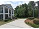 Charming home with a landscaped yard, circular driveway, and inviting front porch at 830 Miami Springs Dr, Longwood, FL 32779