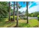 The charming home includes a screened-in porch, a fenced yard, and beautiful landscaping at 830 Miami Springs Dr, Longwood, FL 32779