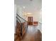 Grand foyer featuring a staircase, elegant lighting, and hardwood floors, creating a welcoming entrance at 830 Miami Springs Dr, Longwood, FL 32779