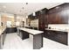Spacious kitchen featuring custom cabinets, granite countertops, stainless steel appliances, and ample storage at 830 Miami Springs Dr, Longwood, FL 32779