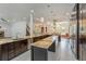 Open kitchen features a large island, granite countertops, and stainless steel appliances at 830 Miami Springs Dr, Longwood, FL 32779