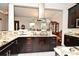A kitchen showcasing granite countertops, custom cabinetry, and modern stainless steel appliances at 830 Miami Springs Dr, Longwood, FL 32779