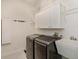 Laundry room with washing machine, dryer, utility sink, and storage at 830 Miami Springs Dr, Longwood, FL 32779