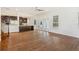 Open floorplan living room showcasing the hardwood floors and kitchen access at 830 Miami Springs Dr, Longwood, FL 32779