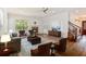 Nicely staged living room with hardwood floors, neutral decor, and a fireplace at 830 Miami Springs Dr, Longwood, FL 32779