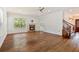 Spacious living room featuring a fireplace, hardwood floors, and ample natural light at 830 Miami Springs Dr, Longwood, FL 32779