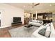 Inviting living room featuring hardwood floors, neutral color palette, plush sofas, and contemporary decor at 830 Miami Springs Dr, Longwood, FL 32779
