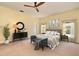 Serene main bedroom suite featuring a plush bed, dresser, and natural light from the window at 830 Miami Springs Dr, Longwood, FL 32779
