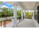 Outdoor porch with decorative columns and landscaping views at 830 Miami Springs Dr, Longwood, FL 32779