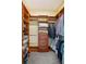 Walk-in closet featuring custom wood shelving and ample storage space for clothes and accessories at 830 Miami Springs Dr, Longwood, FL 32779