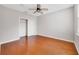 A bedroom featuring hardwood floors, a ceiling fan, and a closet at 8414 Frescada Ct, Orlando, FL 32836