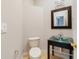 A half bathroom featuring a unique glass bowl sink and modern fixtures at 8414 Frescada Ct, Orlando, FL 32836