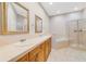 A spacious main bathroom with double sinks, a soaking tub, and a glass-enclosed shower at 8414 Frescada Ct, Orlando, FL 32836