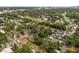 Expansive aerial shot showcasing a golf community, trees, and city views at 849 Driver Ave, Winter Park, FL 32789