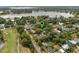 Aerial view of a green community with homes, trees, and a green pin location at 849 Driver Ave, Winter Park, FL 32789