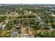 Scenic aerial view featuring homes nestled amidst lush greenery near a golf course at 849 Driver Ave, Winter Park, FL 32789