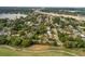 Golf community near highway and waterfront showcasing homes nestled within mature landscaping at 849 Driver Ave, Winter Park, FL 32789