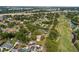 Golf-side neighborhood with homes, mature trees, and ponds in a tranquil setting at 849 Driver Ave, Winter Park, FL 32789