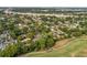Expansive aerial view of a charming neighborhood with lush greenery and nearby golf course at 849 Driver Ave, Winter Park, FL 32789