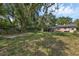 Beautiful large backyard features a picnic table, mature trees, and grass at 849 Driver Ave, Winter Park, FL 32789