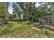 Spacious backyard featuring mature trees and a picnic table at 849 Driver Ave, Winter Park, FL 32789