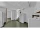Unfinished basement area with access to laundry, storage, and stairs at 849 Driver Ave, Winter Park, FL 32789