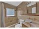 Bathroom features a vanity, toilet, tub and shower combination and neutral tile work at 849 Driver Ave, Winter Park, FL 32789
