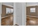 View of two bedrooms featuring hardwood floors, neutral paint, white trim, and natural light at 849 Driver Ave, Winter Park, FL 32789