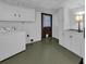 Laundry room features a washer, cabinetry, and exterior door access at 849 Driver Ave, Winter Park, FL 32789