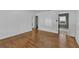Spacious living room featuring gleaming hardwood floors, ample natural light, and neutral white walls at 849 Driver Ave, Winter Park, FL 32789