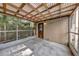 Large screened porch with concrete flooring and wood roof at 849 Driver Ave, Winter Park, FL 32789